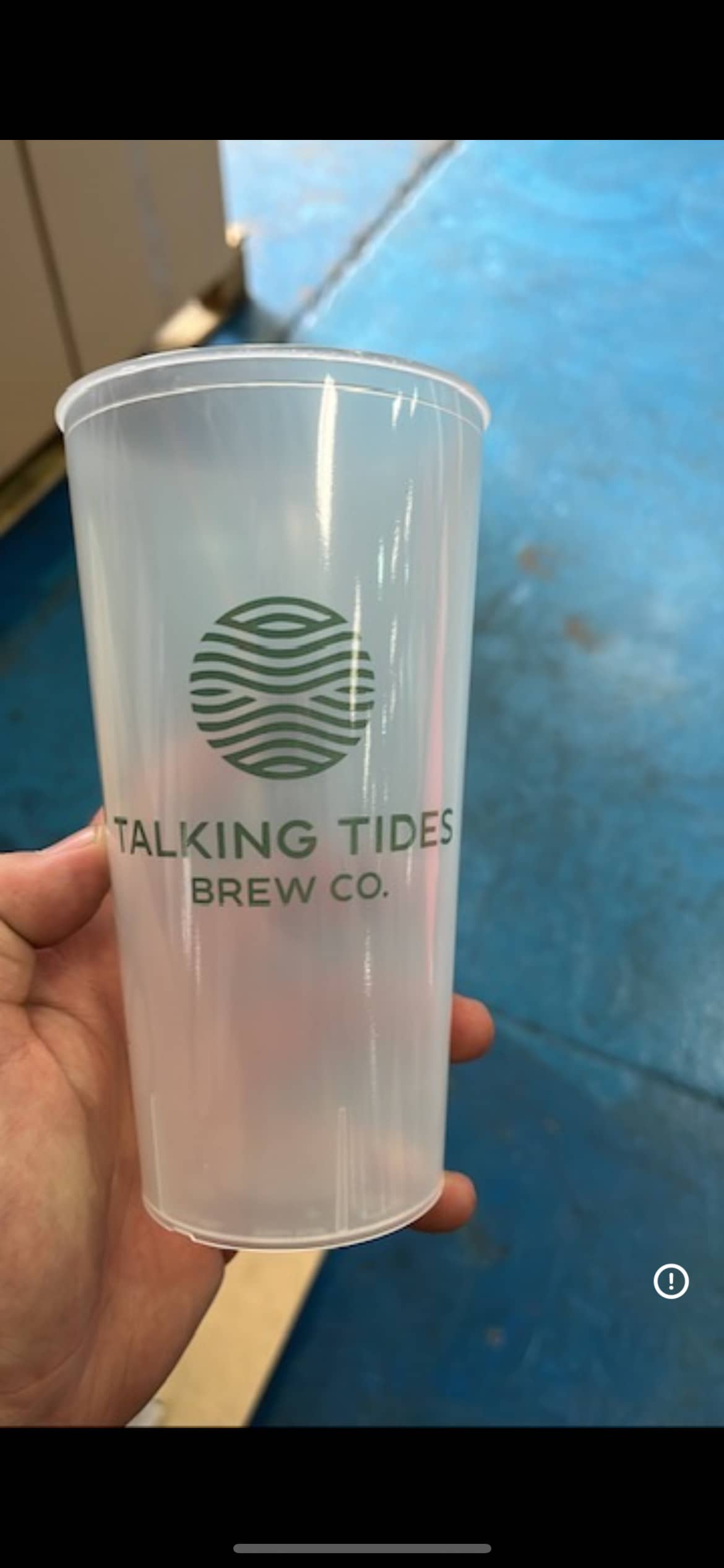 Group using custom printed pint cups outdoors